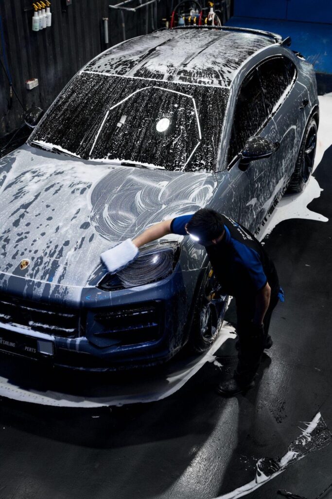 detail experts washing a car